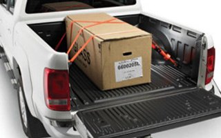Plastic pickup truck load compartment tray with load secured according to StVZO 